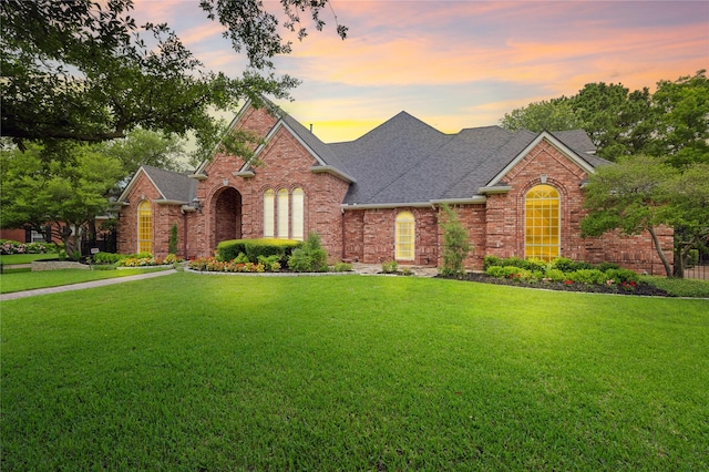 8005 Jefferson Cir, Colleyville, TX 76034 - traditional-style house with roof with shingles, brick siding, and a front lawn