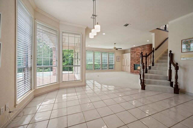 8005 Jefferson Cir, Colleyville, TX 76034 - unfurnished living room featuring ceiling fan, stairway, light tile patterned floors, crown molding, and light carpet