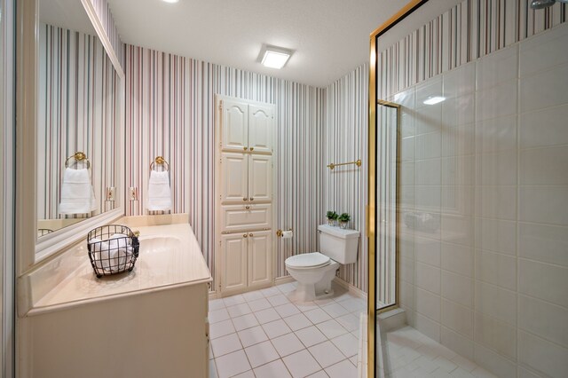 8005 Jefferson Cir, Colleyville, TX 76034 - full bathroom featuring wallpapered walls, vanity, tile patterned floors, a shower stall, and toilet