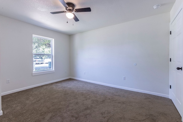 112 S Lakeview Dr, Lacy Lakeview, TX 76705 - unfurnished room with a ceiling fan, dark colored carpet, and baseboards
