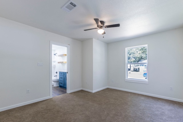 112 S Lakeview Dr, Lacy Lakeview, TX 76705 - empty room with dark colored carpet, ceiling fan, and baseboards