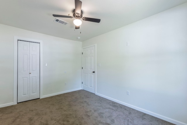 112 S Lakeview Dr, Lacy Lakeview, TX 76705 - unfurnished bedroom featuring carpet floors, baseboards, a closet, and a ceiling fan