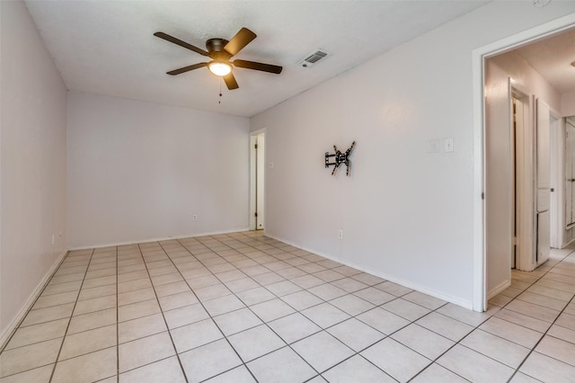 1709 Meadow Vly, Irving, TX 75060 - spare room with ceiling fan, light tile patterned flooring, and baseboards