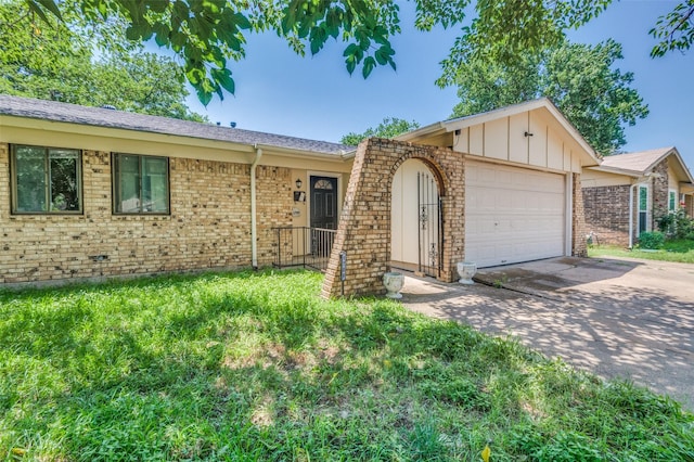 1709 Meadow Vly, Irving, TX 75060 - ranch-style home with concrete driveway, an attached garage, brick siding, and a front yard
