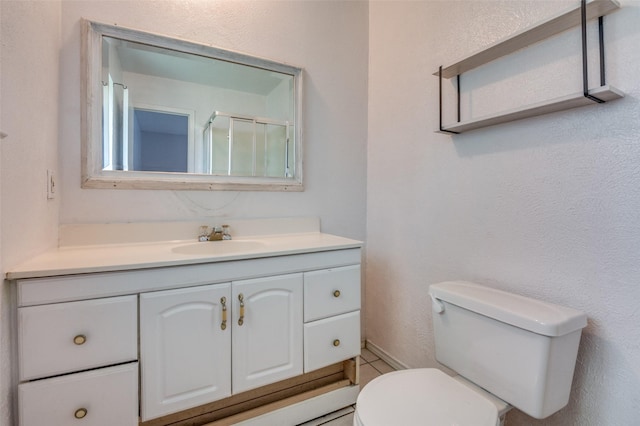 1709 Meadow Vly, Irving, TX 75060 - bathroom featuring toilet, vanity, and an enclosed shower