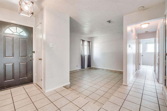 1709 Meadow Vly, Irving, TX 75060 - entrance foyer with light tile patterned flooring and baseboards