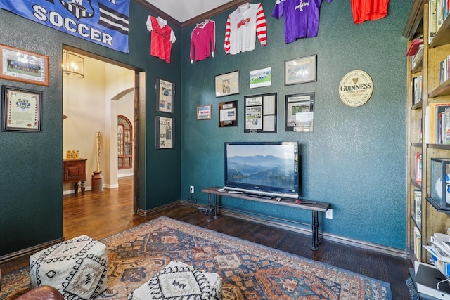 114 Piper Pkwy, Waxahachie, TX 75165 - sitting room with wood finished floors, arched walkways, and baseboards