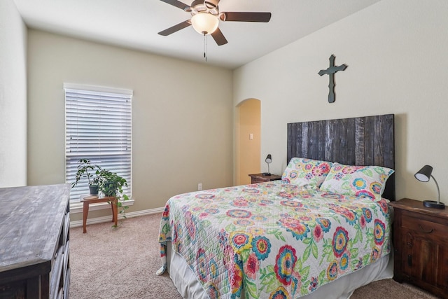 114 Piper Pkwy, Waxahachie, TX 75165 - carpeted bedroom with arched walkways, a ceiling fan, and baseboards