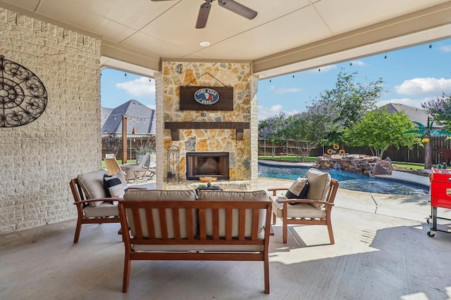 114 Piper Pkwy, Waxahachie, TX 75165 - fenced backyard with ceiling fan, an outdoor living space with a fireplace, and a patio