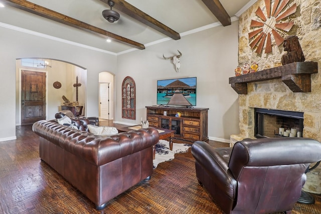 114 Piper Pkwy, Waxahachie, TX 75165 - living area featuring arched walkways, beam ceiling, baseboards, a stone fireplace, and wood finished floors