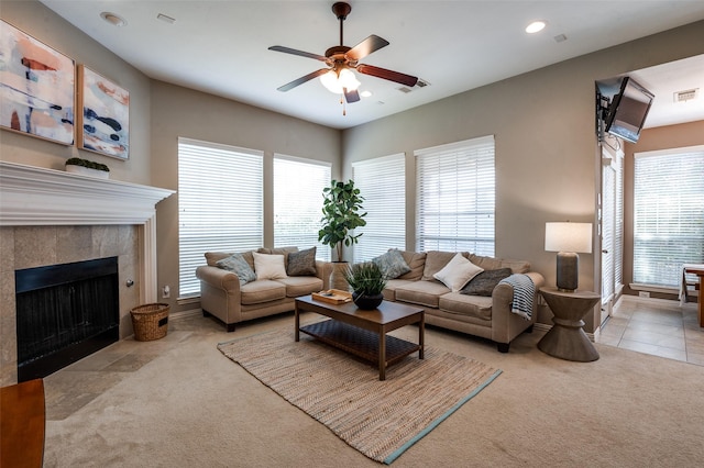 6312 Valley View Dr, Mckinney, TX 75071 - carpeted living room with a ceiling fan, a tiled fireplace, recessed lighting, and baseboards