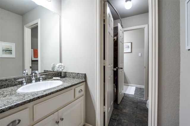 6312 Valley View Dr, Mckinney, TX 75071 - bathroom featuring vanity and stone finish flooring