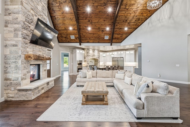 12877 Foutch Rd, Pilot Point, TX 76258 - living room with high vaulted ceiling, wood ceiling with exposed beams, baseboards, dark wood-style flooring, and a fireplace