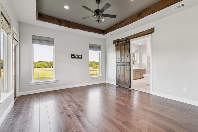 12877 Foutch Rd, Pilot Point, TX 76258 - spare room with a barn door, ceiling fan, wood finished floors, baseboards, and recessed lighting