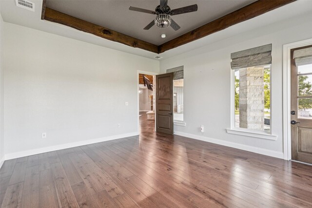 12877 Foutch Rd, Pilot Point, TX 76258 - unfurnished room featuring ceiling fan, beam ceiling, dark wood finished floors, and baseboards