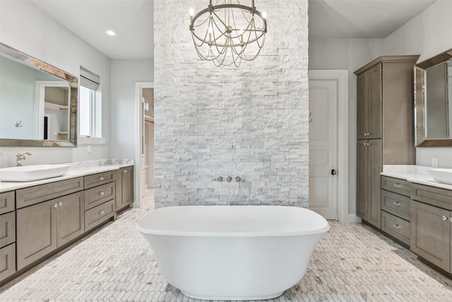 12877 Foutch Rd, Pilot Point, TX 76258 - full bathroom featuring a soaking tub, two vanities, a chandelier, and tile patterned floors