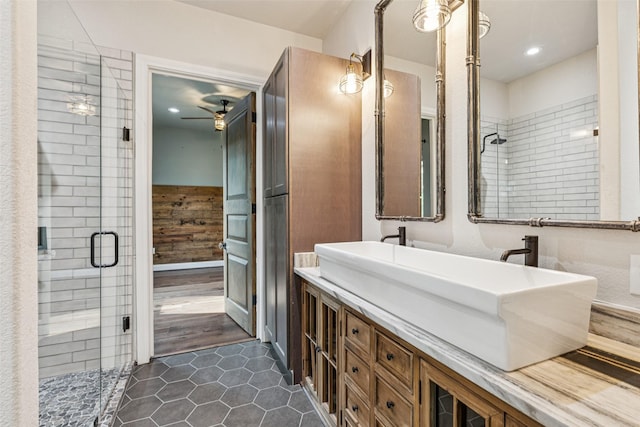 12877 Foutch Rd, Pilot Point, TX 76258 - full bath featuring double vanity, a stall shower, a ceiling fan, tile patterned floors, and recessed lighting