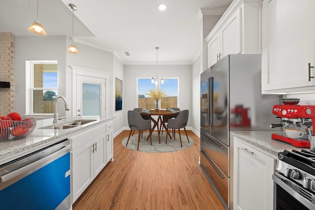 120 Hay Meadow Dr, Winona, TX 75792 - kitchen featuring dishwashing machine, a sink, crown molding, light wood-style floors, and white cabinets