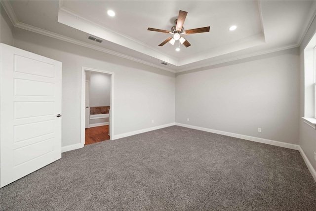 120 Hay Meadow Dr, Winona, TX 75792 - unfurnished bedroom with dark carpet, a raised ceiling, crown molding, recessed lighting, and ensuite bath