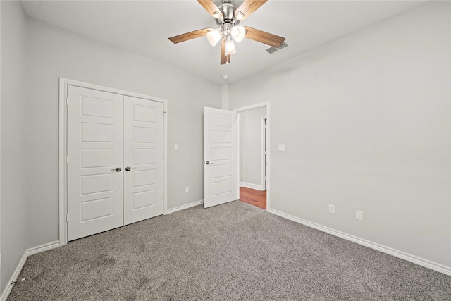 120 Hay Meadow Dr, Winona, TX 75792 - unfurnished bedroom featuring carpet, a closet, baseboards, and a ceiling fan