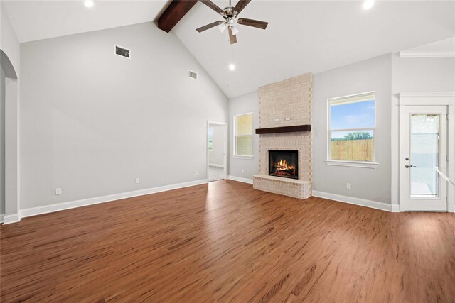 120 Hay Meadow Dr, Winona, TX 75792 - unfurnished living room featuring wood finished floors, a ceiling fan, recessed lighting, beamed ceiling, and a fireplace