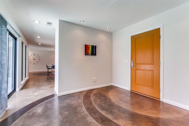 1201 Delmonte Cir, Plano, TX 75075 - foyer featuring finished concrete floors, recessed lighting, and baseboards