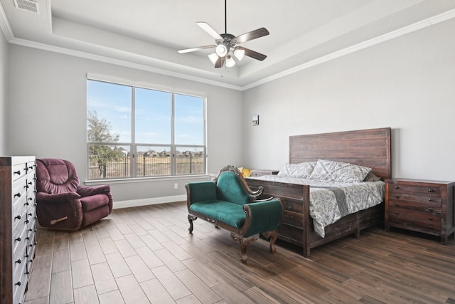 1207 Mae St, Anna, TX 75409 - bedroom featuring a tray ceiling, wood finished floors, crown molding, baseboards, and ceiling fan