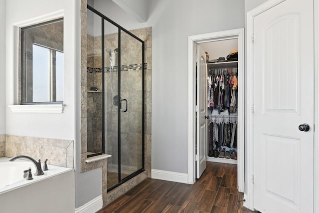 1207 Mae St, Anna, TX 75409 - full bath featuring a shower stall, a garden tub, baseboards, a spacious closet, and wood tiled floors