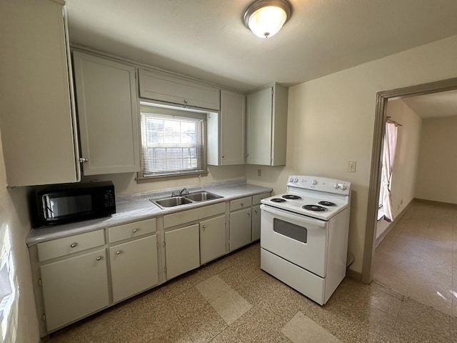 1517 Maple Dr, Garland, TX 75042 - kitchen with white electric stove, black microwave, a sink, and light countertops