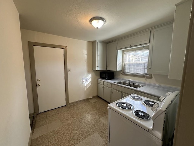 1517 Maple Dr, Garland, TX 75042 - kitchen with electric range, a sink, baseboards, and light countertops