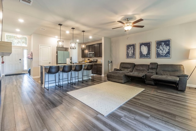 7020 Llano Dr, Waco, TX 76633 - living area featuring recessed lighting, dark wood finished floors, a ceiling fan, and baseboards