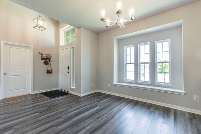 7020 Llano Dr, Waco, TX 76633 - foyer entrance with a chandelier, dark wood-style flooring, and baseboards