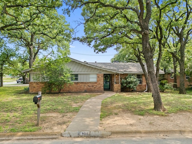 521 Brookview Dr, Hurst, TX 76054 - ranch-style home featuring brick siding and a front lawn