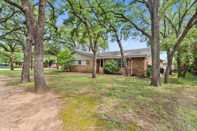 521 Brookview Dr, Hurst, TX 76054 - view of front of property with brick siding and a front lawn