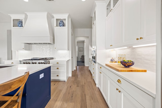 3201 Dovehill Dr, Northlake, TX 76247 - kitchen with custom exhaust hood, tasteful backsplash, light countertops, white cabinets, and recessed lighting