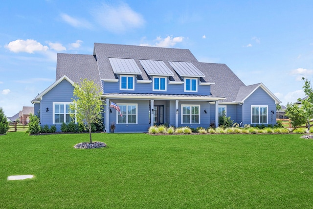 3201 Dovehill Dr, Northlake, TX 76247 - view of front of home with a standing seam roof, a front yard, metal roof, and roof with shingles