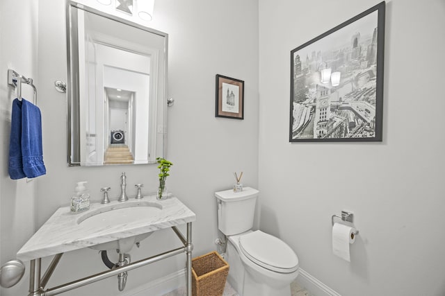 3201 Dovehill Dr, Northlake, TX 76247 - bathroom with toilet, baseboards, and a sink