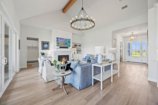 3201 Dovehill Dr, Northlake, TX 76247 - living room featuring a chandelier, light wood finished floors, beam ceiling, a glass covered fireplace, and high vaulted ceiling