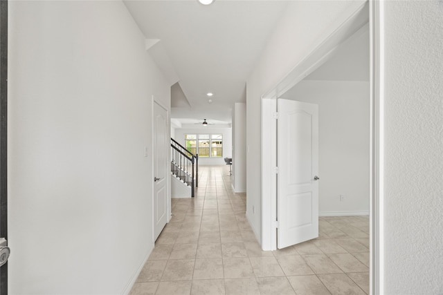 1028 W Dr, Aubrey, TX 76227 - corridor with stairs, recessed lighting, light tile patterned flooring, and baseboards