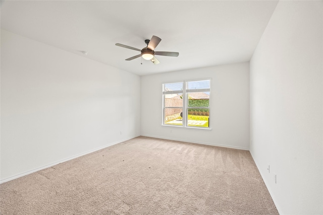 1028 W Dr, Aubrey, TX 76227 - spare room featuring light colored carpet, a ceiling fan, baseboards, and a smoke detector