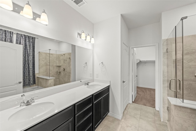 1028 W Dr, Aubrey, TX 76227 - full bath featuring a shower stall, double vanity, a walk in closet, and tile patterned floors