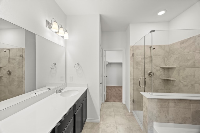 1028 W Dr, Aubrey, TX 76227 - full bathroom with a shower stall, vanity, a spacious closet, a bath, and baseboards