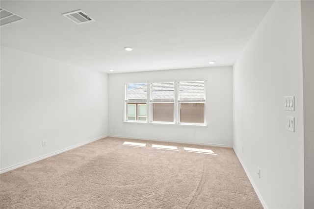 1028 W Dr, Aubrey, TX 76227 - spare room with light colored carpet, baseboards, and recessed lighting