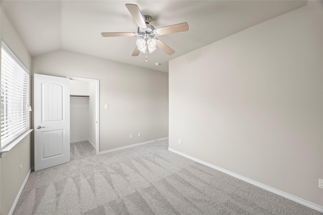 1825 Sanderlain Ln, Allen, TX 75002 - unfurnished bedroom featuring baseboards, light colored carpet, lofted ceiling, a walk in closet, and a ceiling fan