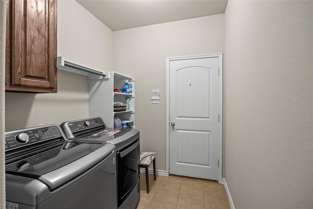 1825 Sanderlain Ln, Allen, TX 75002 - washroom with washer and clothes dryer, cabinet space, baseboards, and light tile patterned flooring