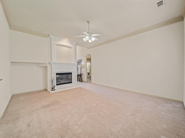 8009 Marathon Dr, Plano, TX 75024 - unfurnished living room with arched walkways, a ceiling fan, carpet, ornamental molding, and a large fireplace