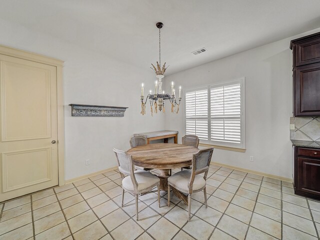 8009 Marathon Dr, Plano, TX 75024 - dining area featuring a chandelier and light tile patterned floors