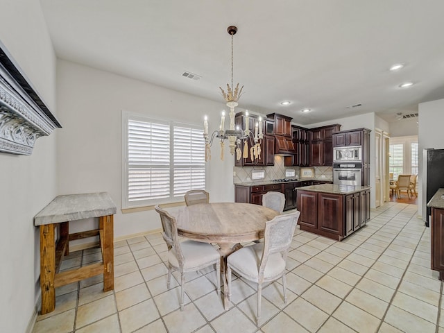 8009 Marathon Dr, Plano, TX 75024 - dining space featuring a chandelier, light tile patterned floors, and recessed lighting