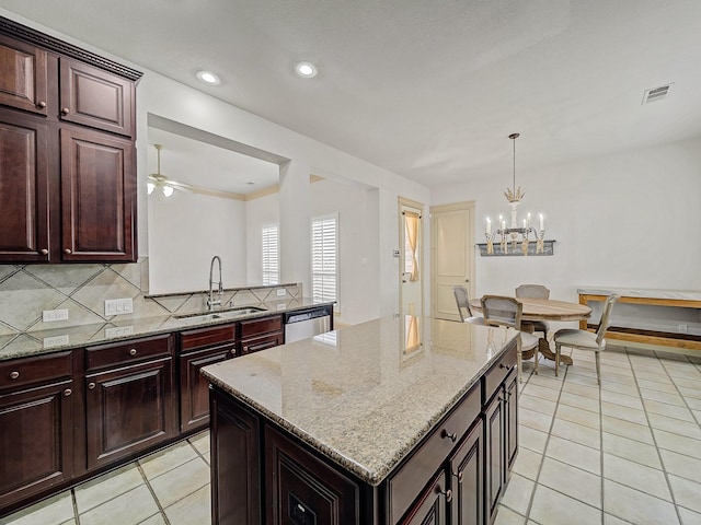 8009 Marathon Dr, Plano, TX 75024 - kitchen featuring stainless steel dishwasher, light tile patterned flooring, a center island, tasteful backsplash, and a ceiling fan