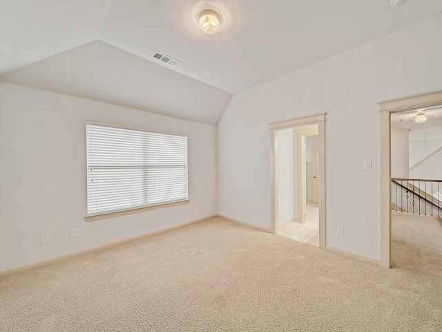 8009 Marathon Dr, Plano, TX 75024 - unfurnished bedroom featuring light colored carpet and vaulted ceiling